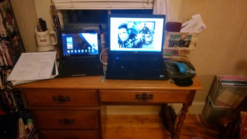 My desk, which currently features everything from dip-pens and paint brushes to dueting computers.